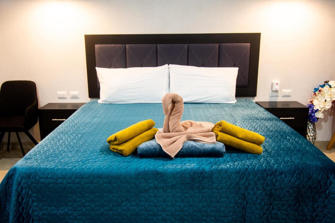 Hotel Casa Tortuga Tulum - Cenotes Park Inclusive Εξωτερικό φωτογραφία A bed with a towel swan